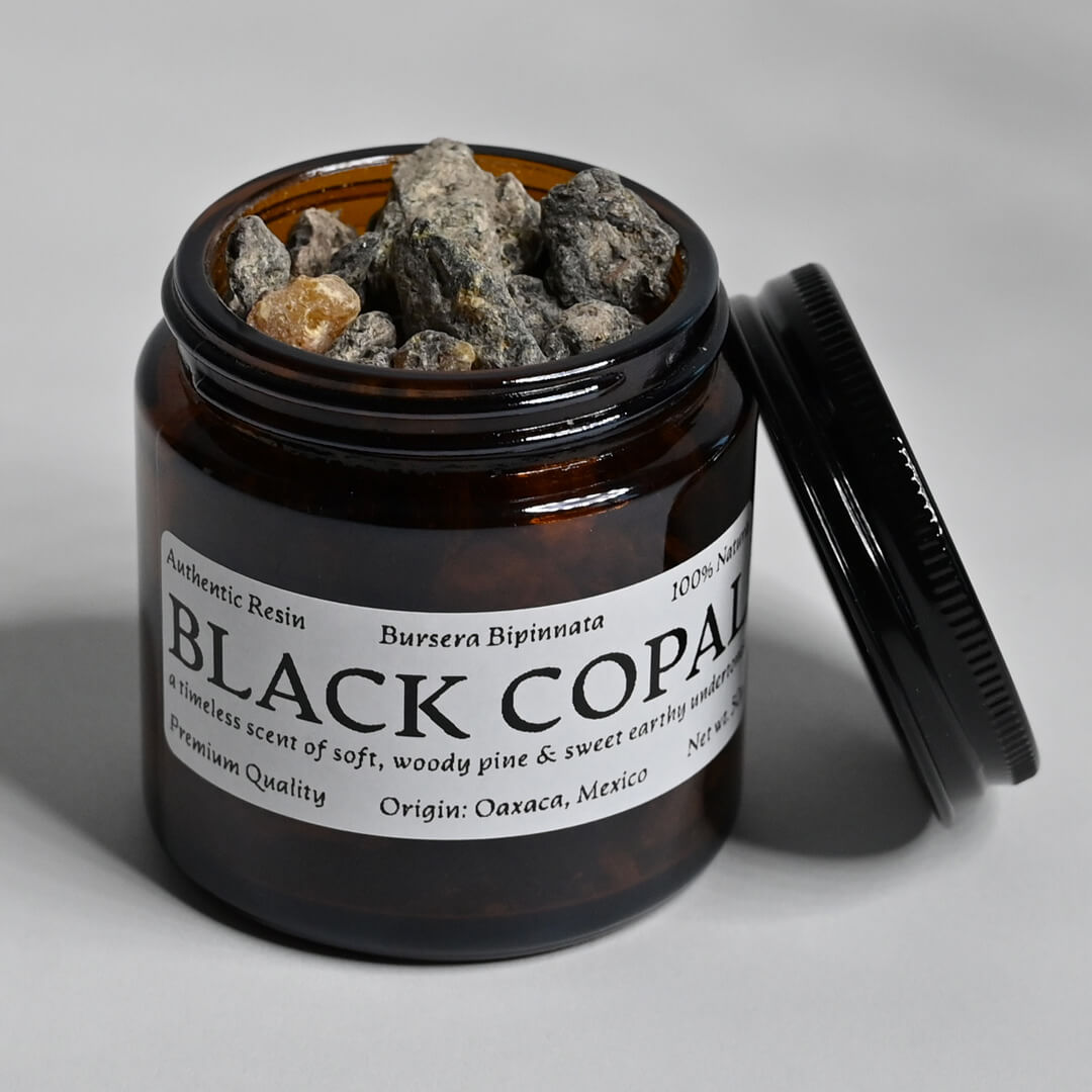 An Open Jar of Black Copal Resin Incense 