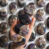 Load image into Gallery viewer, Amethyst Palm Stones on hand