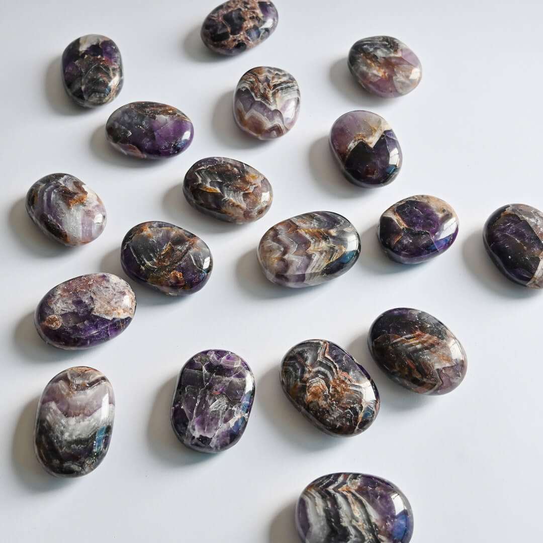 Amethyst Palm Stones on white surface
