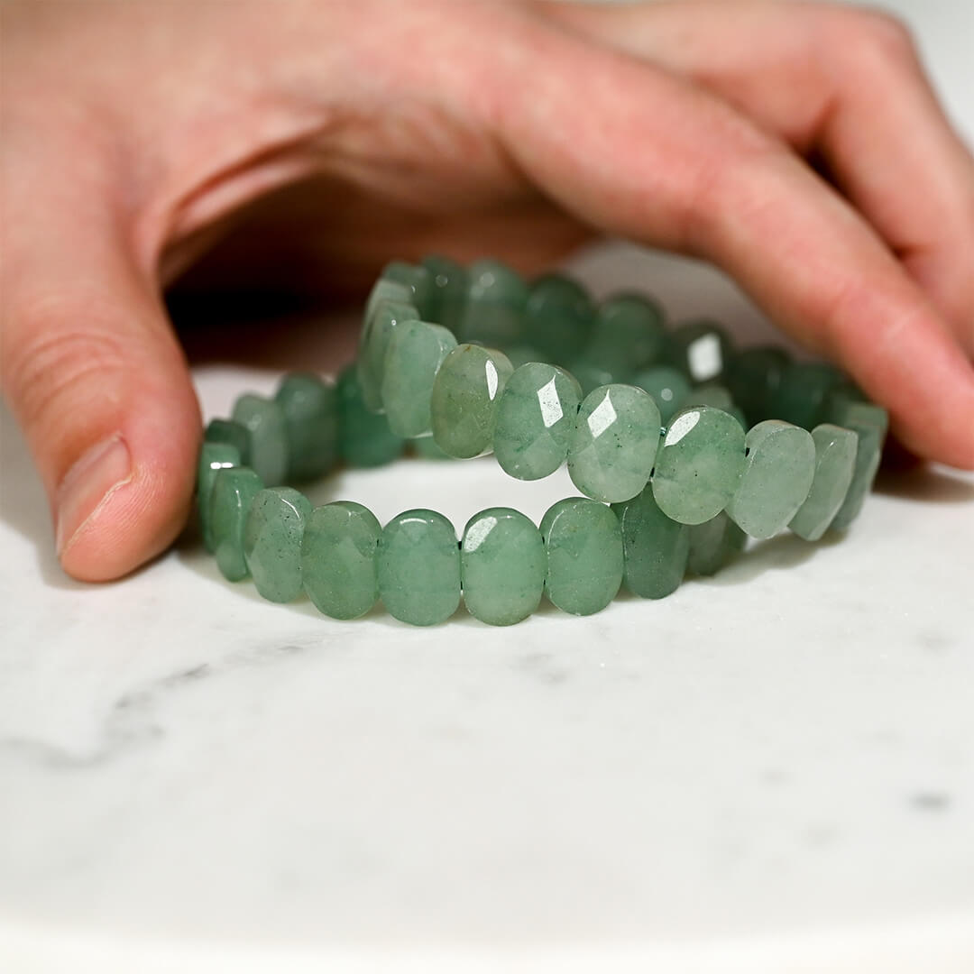 Green-jade-faceted-bracelets-stacked-used-for-emotional-stability