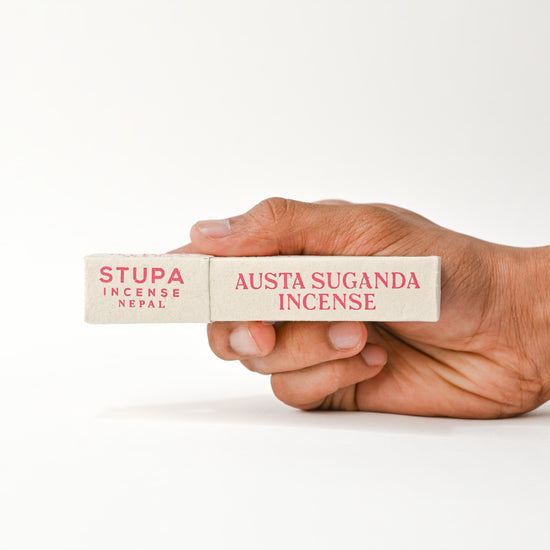 Hand holding Nag Champa Incenses 