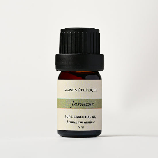 Jasmine Essential Oil 5ml: small amber glass bottle with black cap and Maison Éthérique label reading Jasminum sambac.