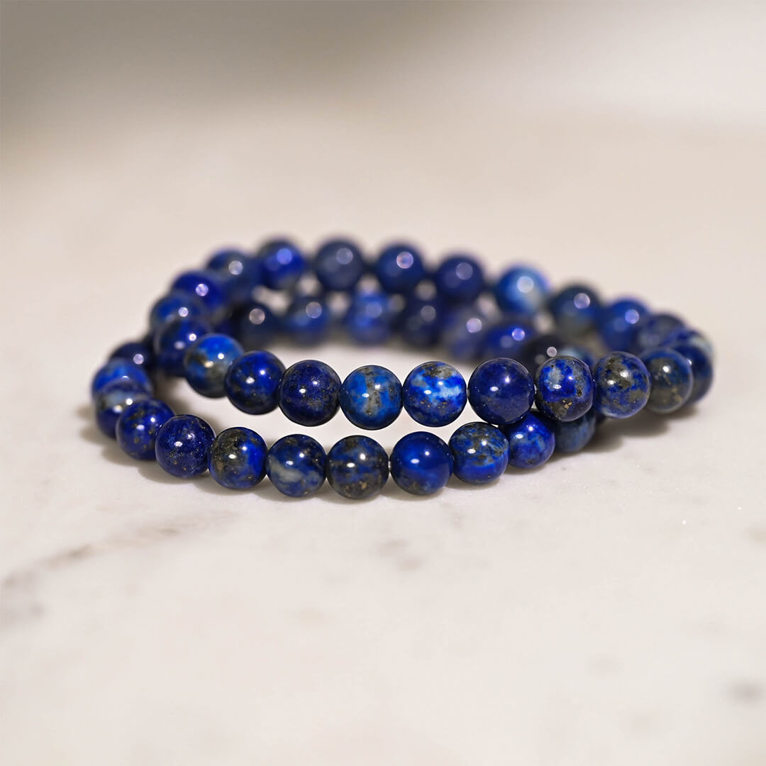 Lapis-Lazuli-Crystal-Bracelets-stacked-on-table-by-Maison-Etherique
