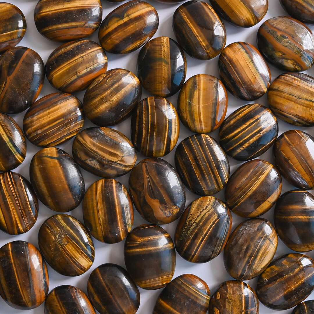 Tiger's Eye Palm Stones placed together