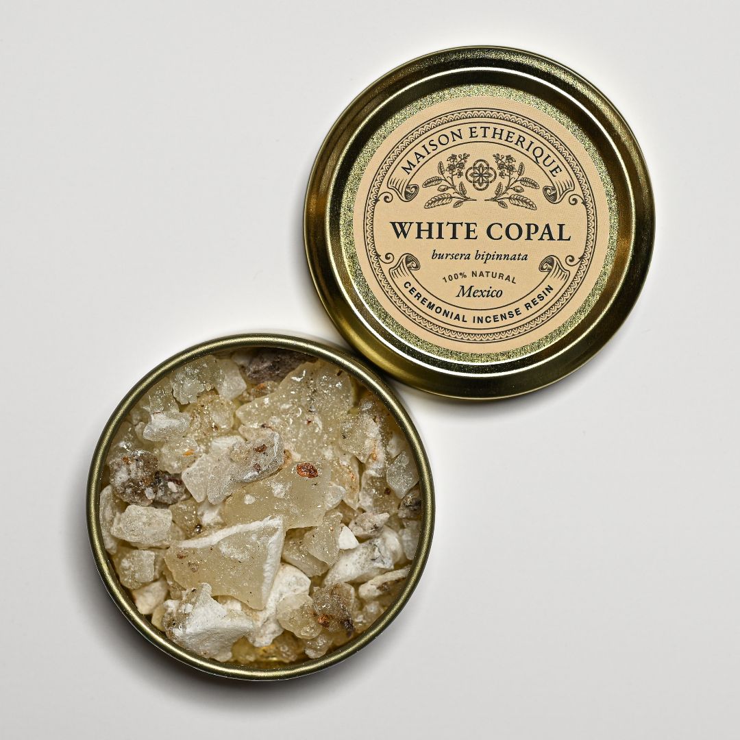 Open tin of white copal resin
