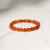 Carnelian gemstone bracelet promotes Sacral Chakra balance, enhancing vitality, confidence, and creativity.