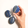 hand_holding_Lapis_Lazuli_Palm_Stone - Maison Éthérique