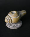 Close view of the Shankh stone incense holder, showing the carved spiral and stick holes.