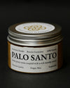 Round tin of Maison Éthérique Palo Santo powder (Bursera graveolens) from Peru with a silver lid, on a dark background.