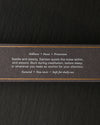 Side of the dark Samten Tibetan incense box with printed text and gold lines, on a dark background.