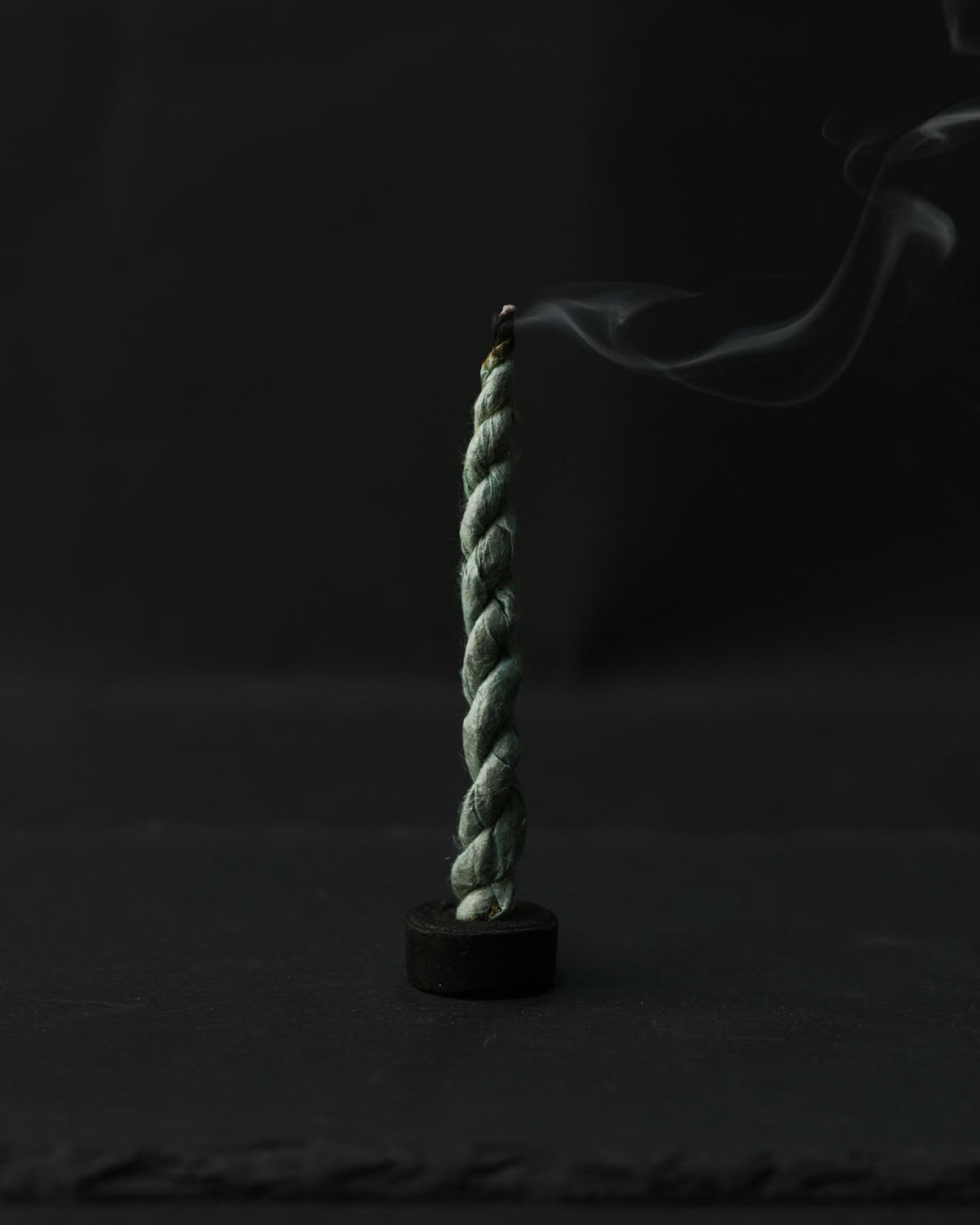 single burning shot of bundle of Devdar Lokta Rope Incense Tube