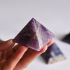 Amethyst pyramid in hand