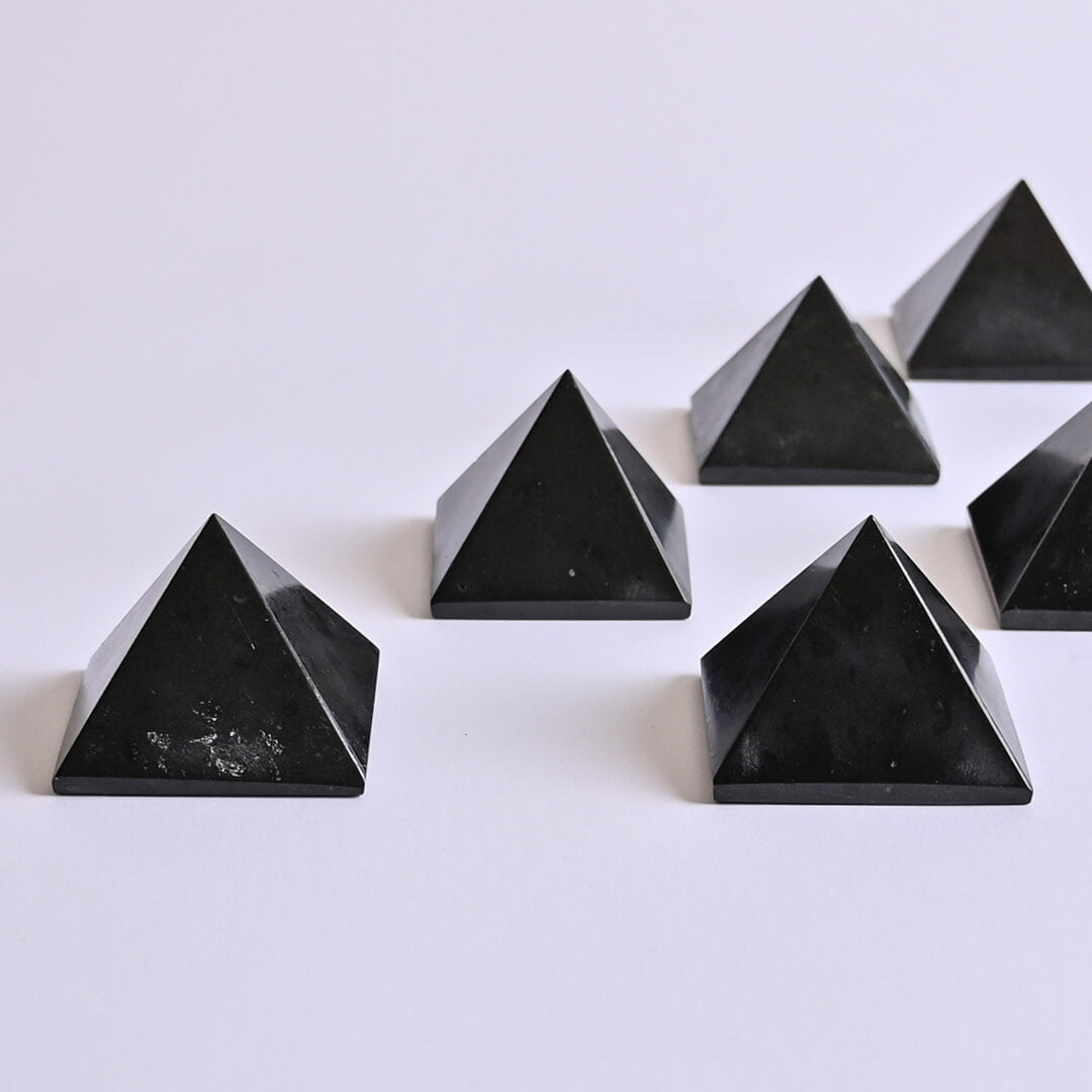 Black Tourmaline Pyramids on white surface