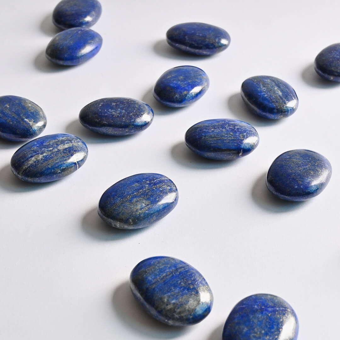 Lapis Lazuli Palm Stones on white surface