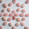 Patterns made by Rose Quartz Palm Stones