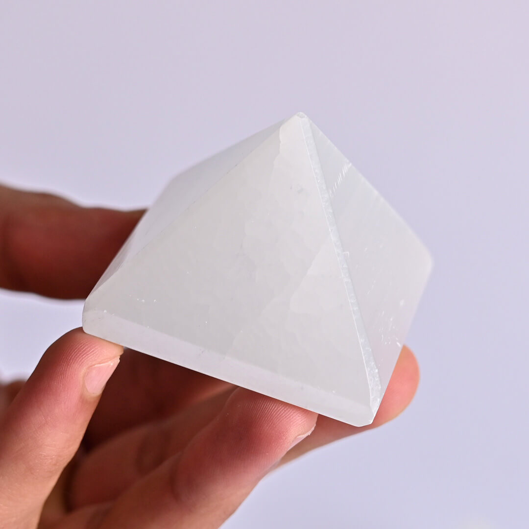 selenite Pyramid  in hand