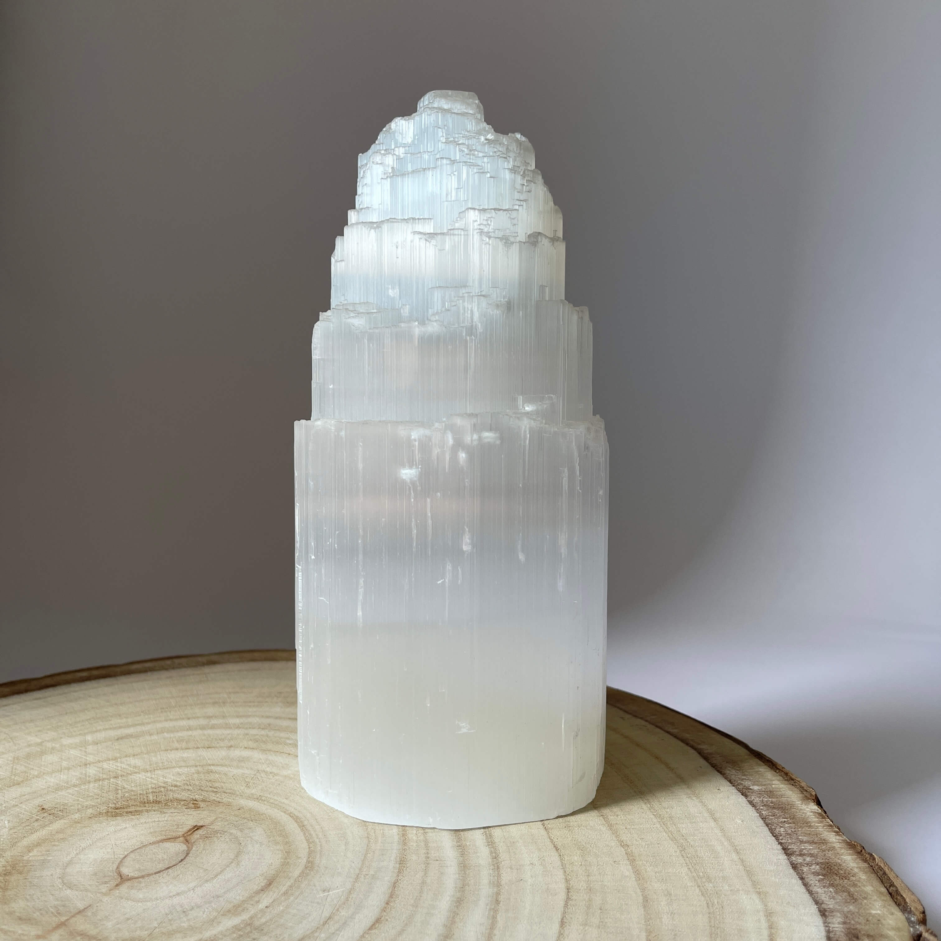Selenite Crystal Tower - 20cm on a table