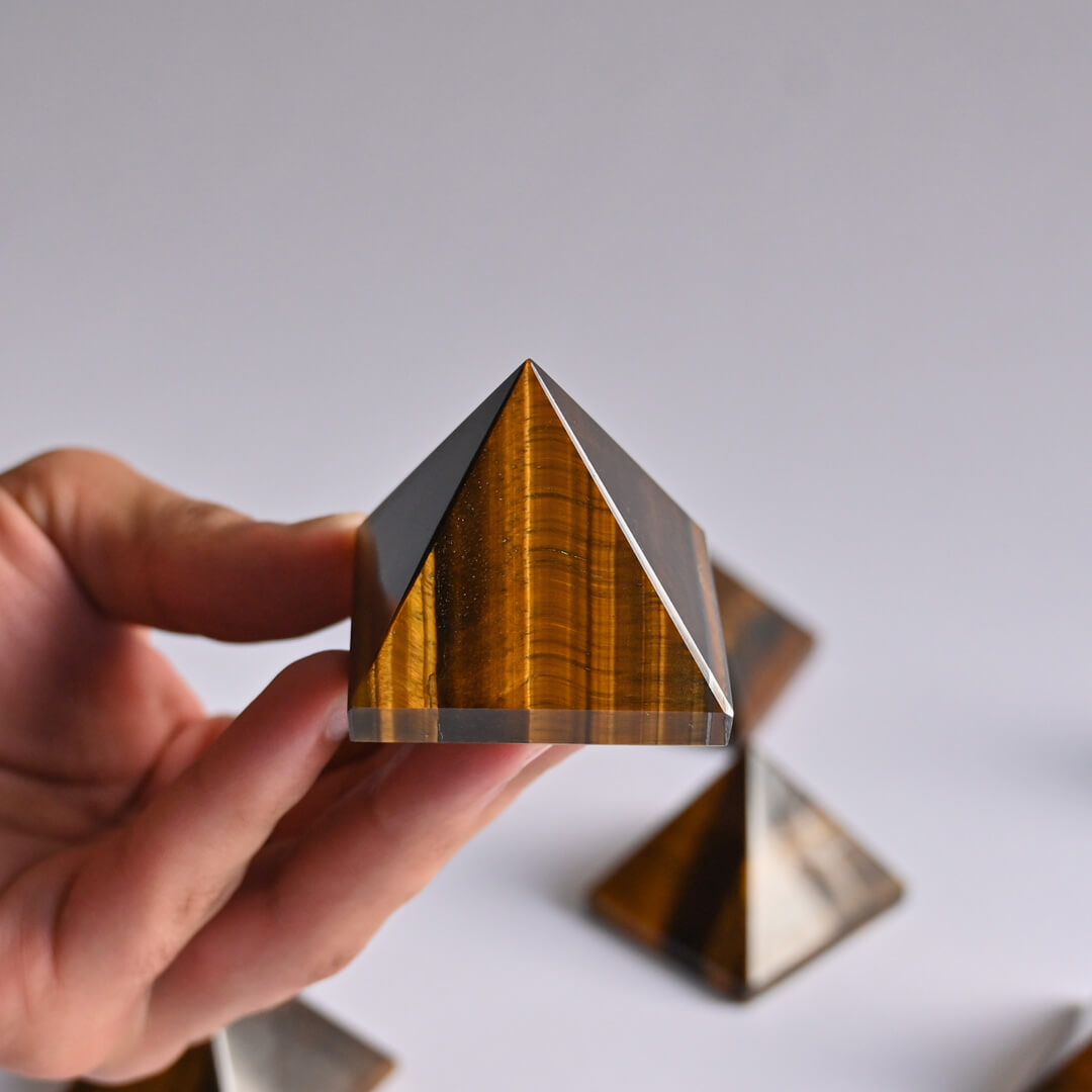 Tiger's Eye pyramid in hand