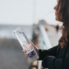Load image into Gallery viewer, A woman holding a Crystal Amethyst bottle